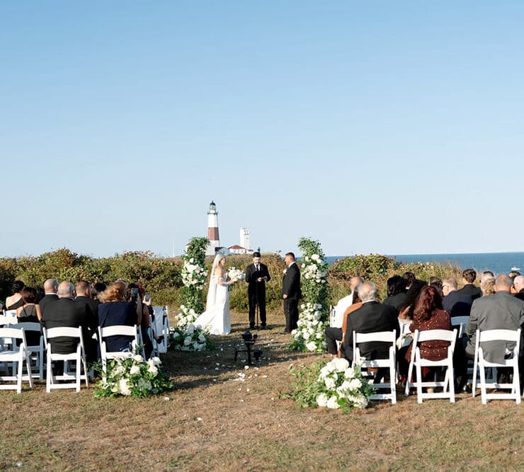 A romantic beach, waterfront, and lighthouse setting for their wedding ceremony