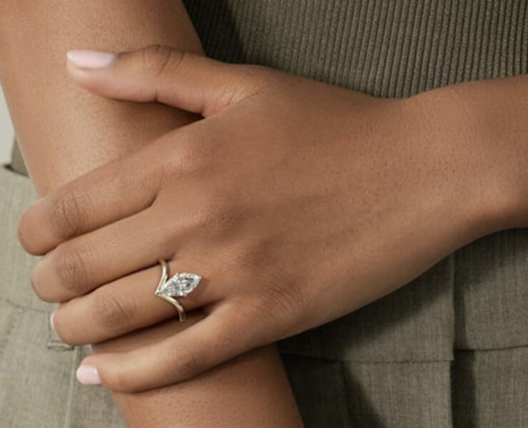 Displaying her lab-grown Marquise engagement ring