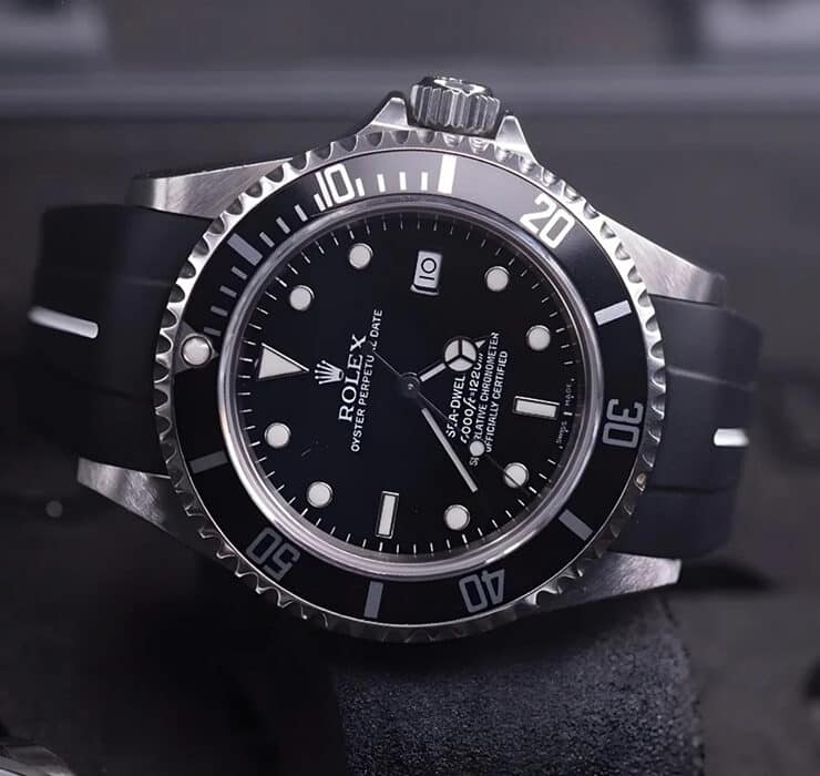 Rolex Sea-Dweller; luxury watch with a black FKM rubber strap worn with formal wedding attire