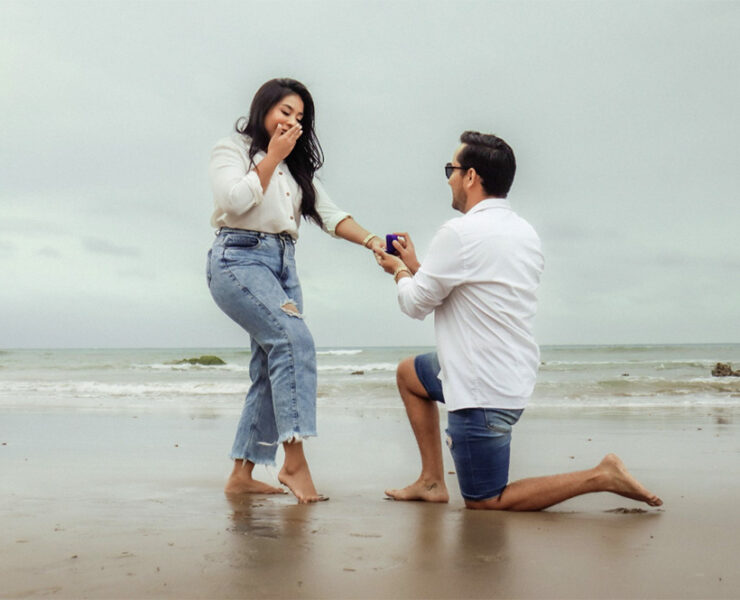 Groom-to-be proposing on one knee on the baach